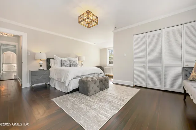 a bed room with a bed and a book shelf