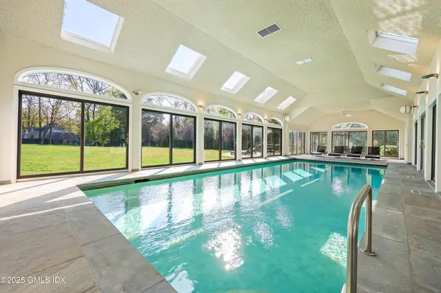 a view of a swimming pool with a patio