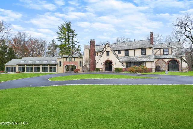 a front view of house with yard and green space
