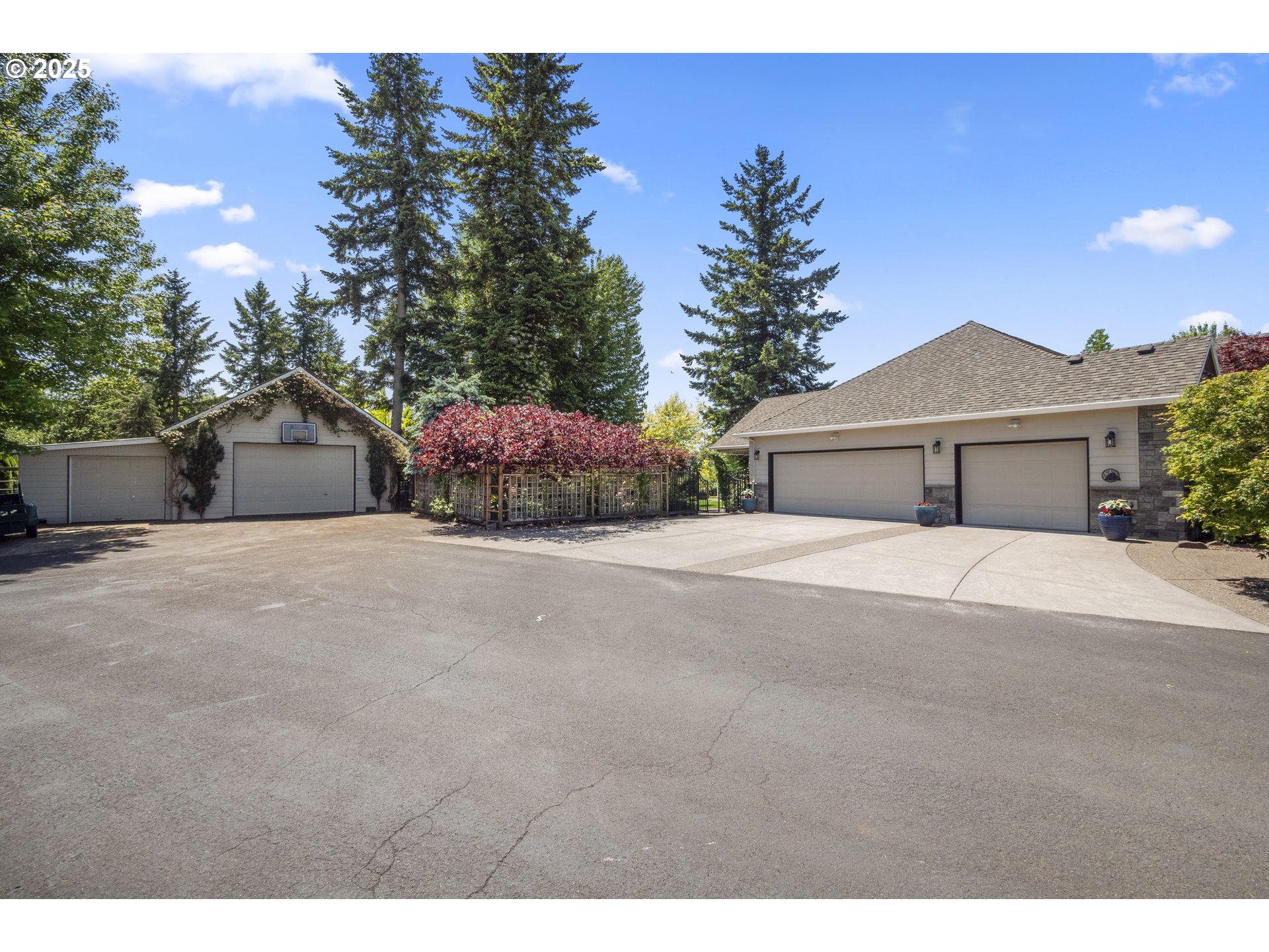 18050 South Ridge Runner Road Oregon City, OR 97045 - Photo 27 of 40 a front view of a house with a yard and garage