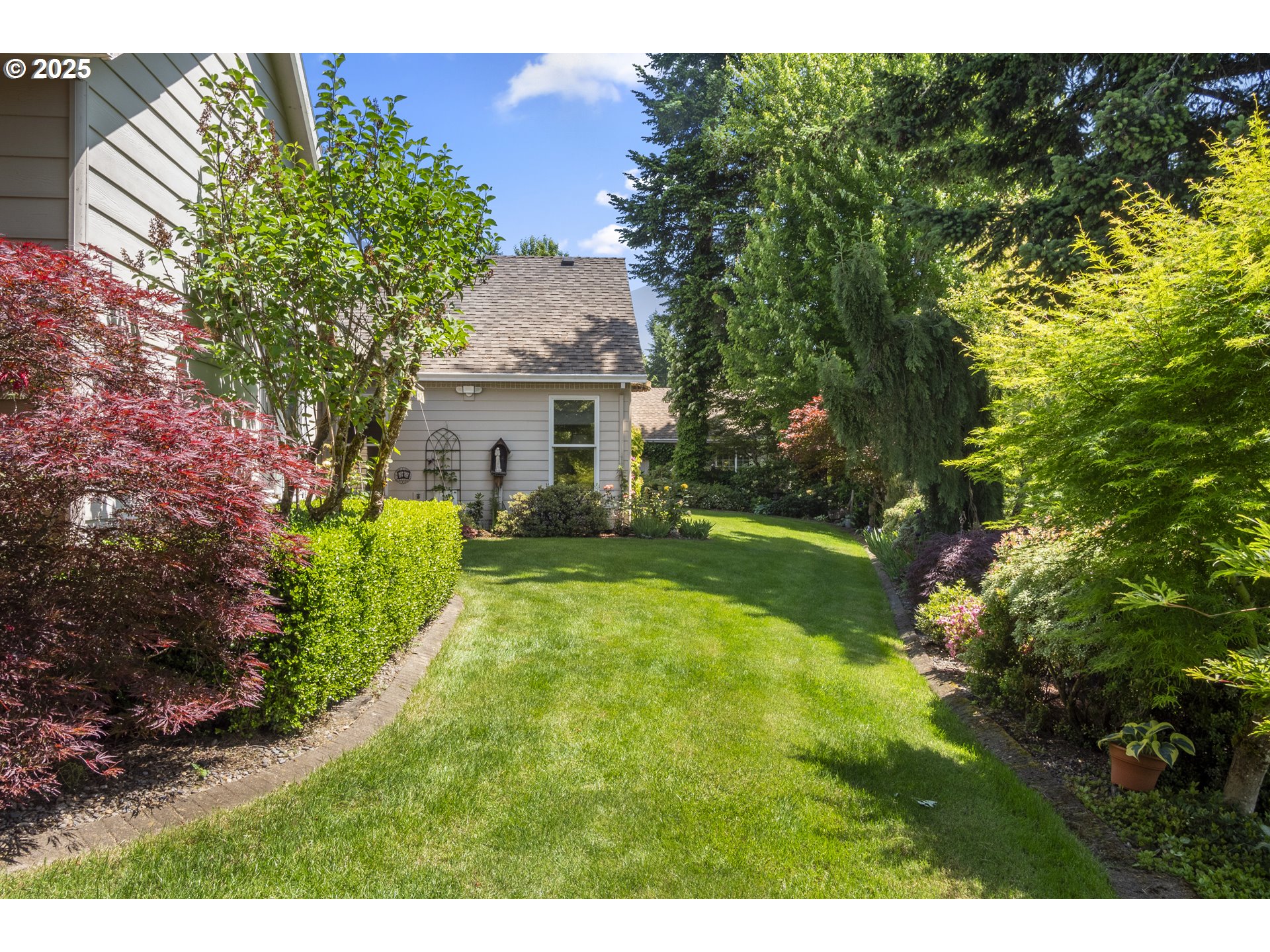 18050 South Ridge Runner Road Oregon City, OR 97045 - Photo 34 of 40 a view of a house with a big yard potted plants and large tree