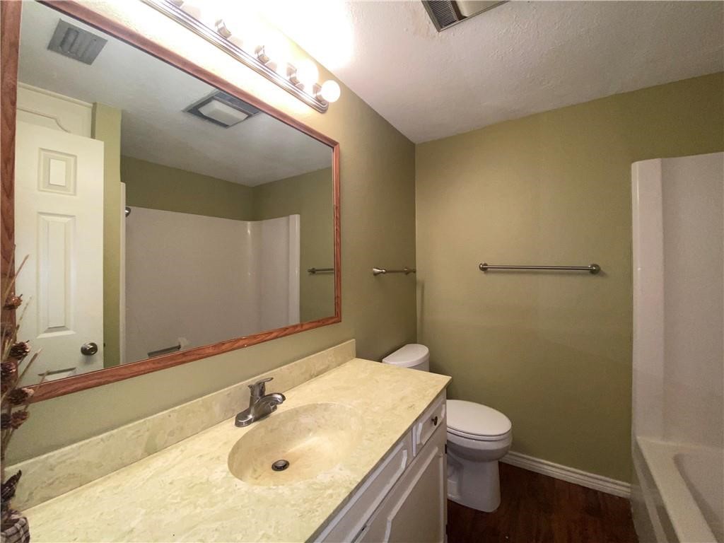 310 Sunset Boulevard Portland, TX 78374 - Photo 14 of 18 a bathroom with a sink toilet and shower