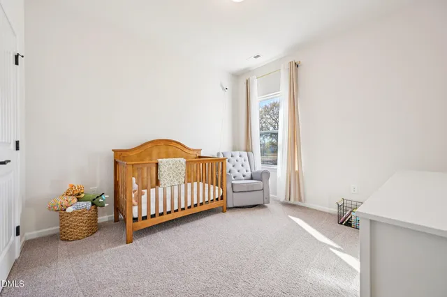 a bed room with a bed and a window