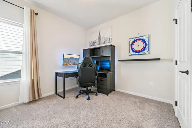 a view of a workspace with furniture