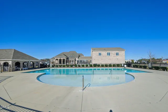 a view of a swimming pool with a lounge chairs