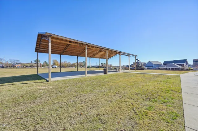 an aerial view of a house with outdoor space