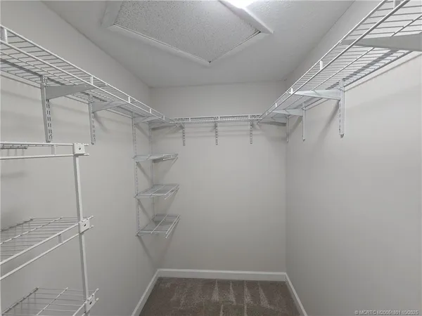a view of a room with racks on the wall