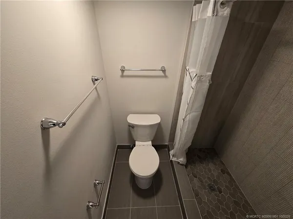 a view of swimming pool from a balcony