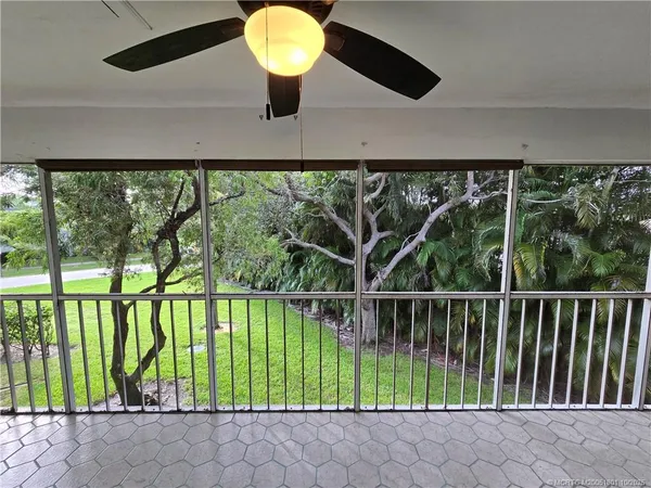 a view of balcony with yard