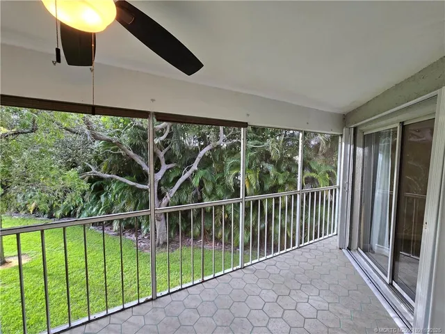a view of a balcony with wooden floor