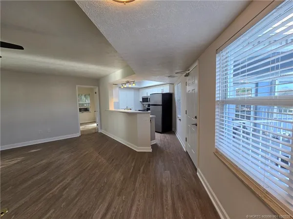 a view of kitchen with wooden floor