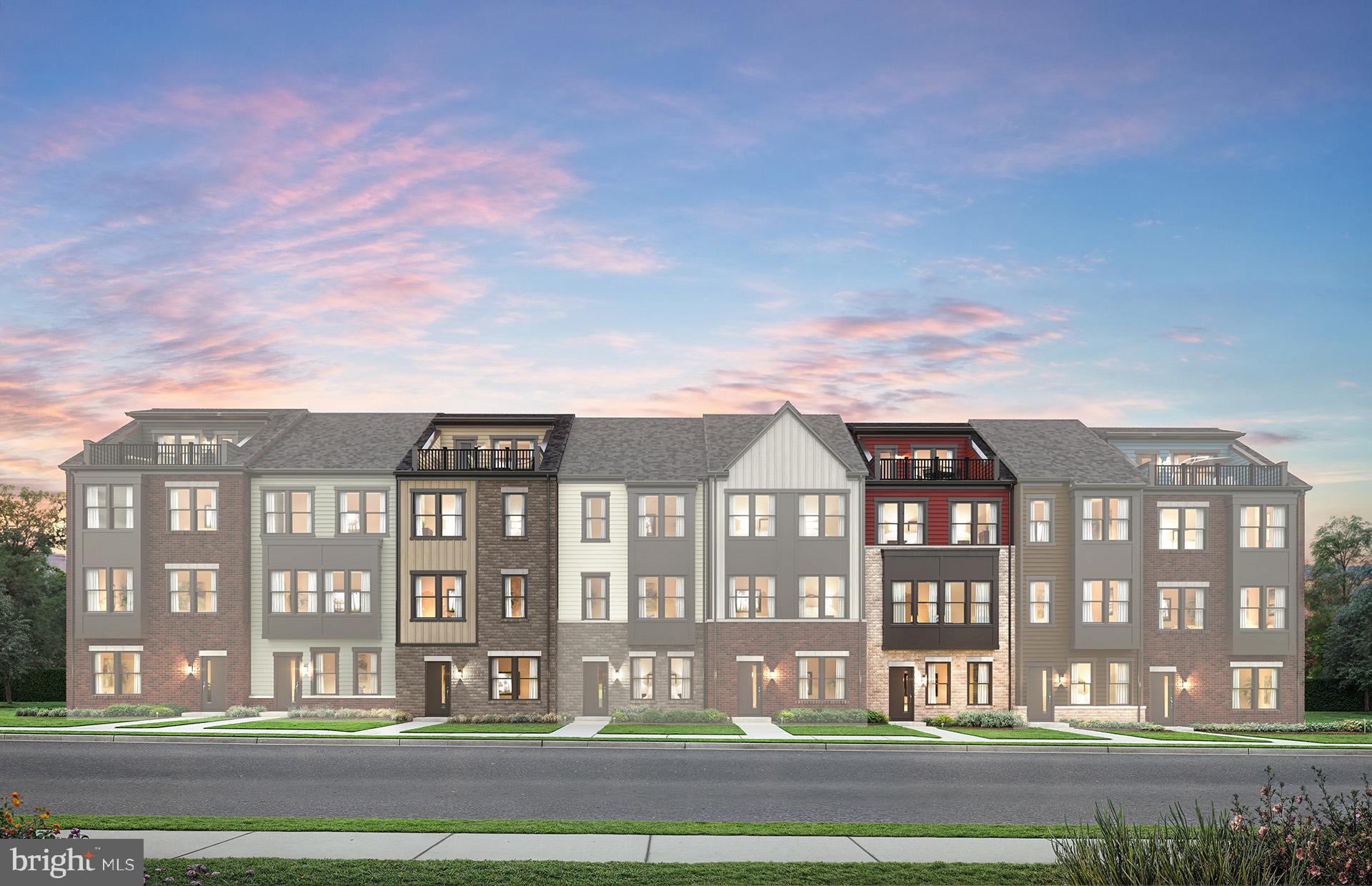 a front view of a residential apartment building with a yard