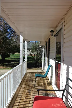 a view of a chairs and tables in the balcony