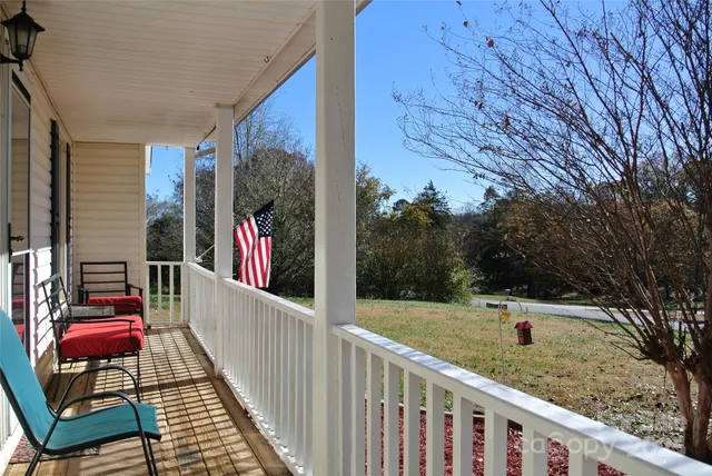 a view of a balcony with chairs