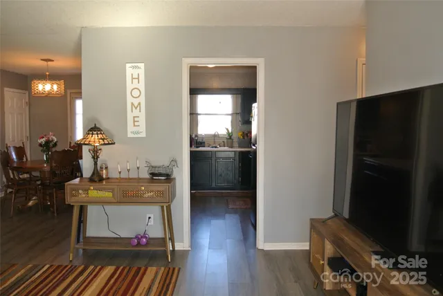 a kitchen with a refrigerator and a stove top oven