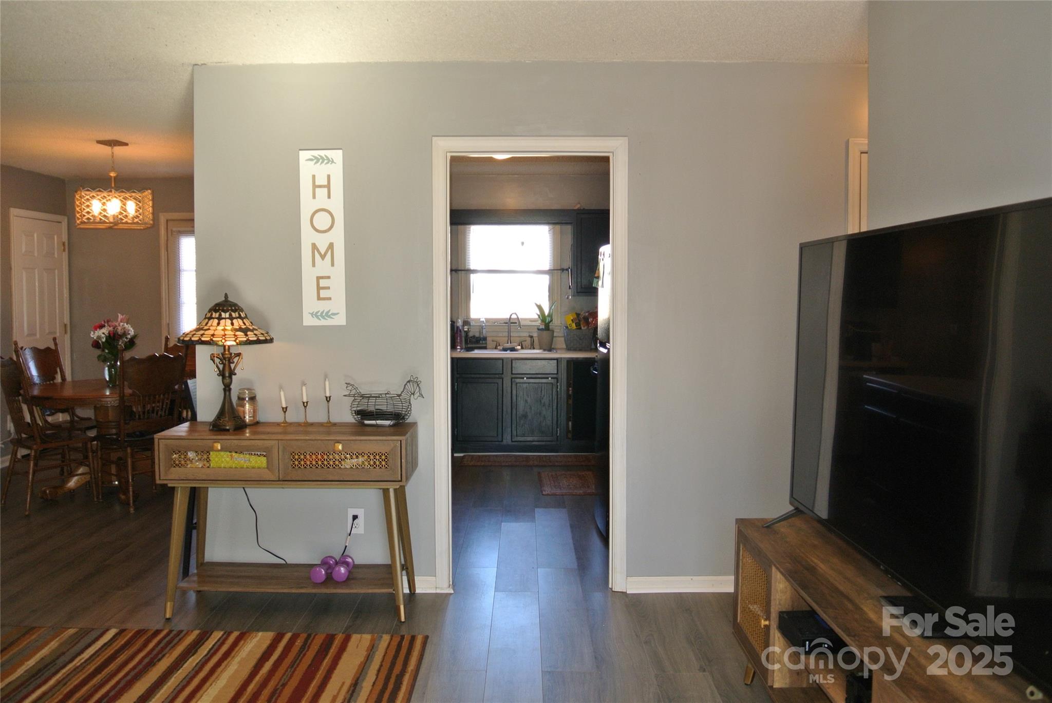 225 McDade Road Forest City, NC 28043 - Photo 16 of 44 a kitchen with a refrigerator and a stove top oven