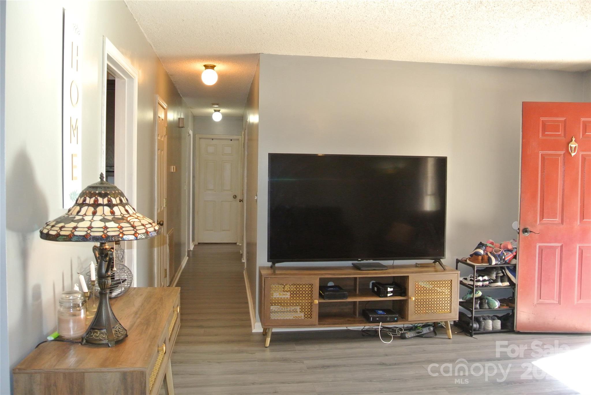 225 McDade Road Forest City, NC 28043 - Photo 23 of 44 a living room with furniture and a flat screen tv