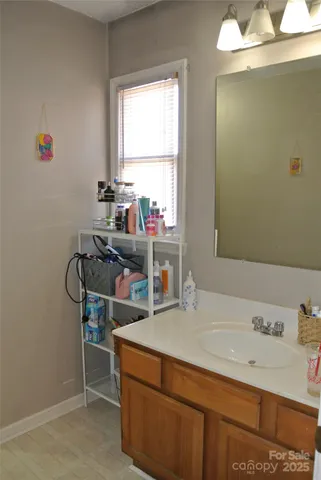 a room with a desk and a window