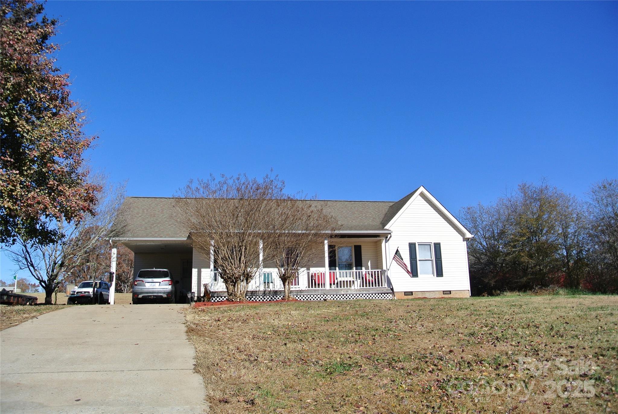 225 McDade Road Forest City, NC 28043 - Photo 4 of 44 a view of a house with backyard and garden