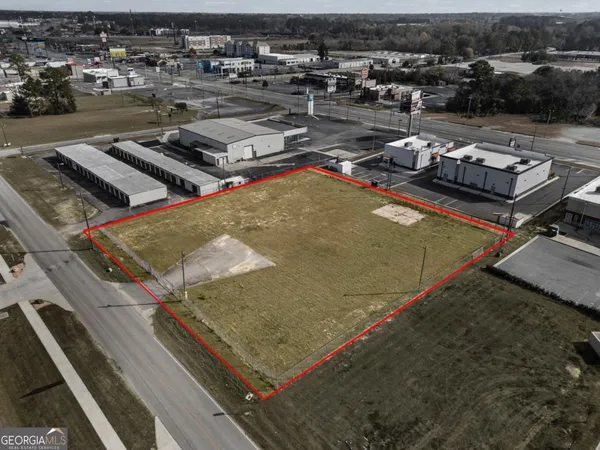 a view of a lake with lawn chairs
