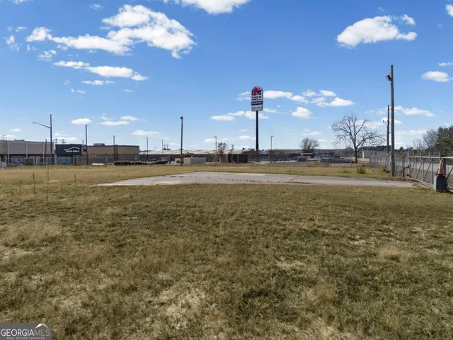 a view of a lake with a big yard