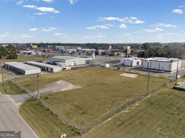a view of a swimming pool with an outdoor seating