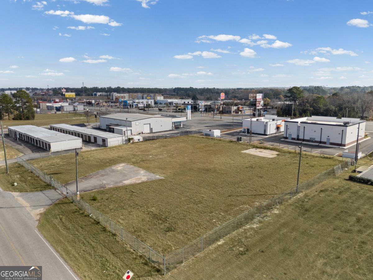 0 Hunt Road Tifton, GA 31794 - Photo 3 of 26 a view of a swimming pool with an outdoor seating