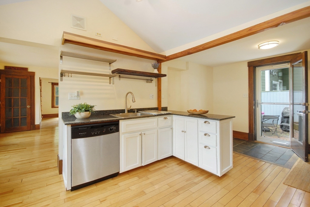 1832 Main Street Concord, MA 01742 - Photo 5 of 25 a kitchen with stainless steel appliances granite countertop a sink and cabinets