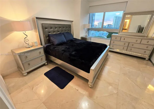 a bed room with a bed furniture and a fireplace