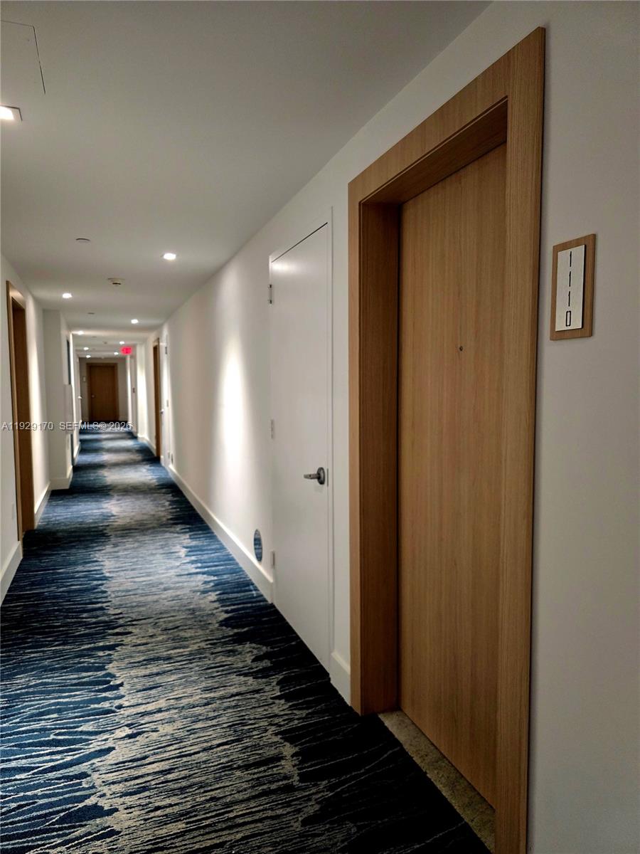 90 Southwest 3rd Street, Unit 1110 Miami, FL 33130 - Photo 30 of 55 a view of a hallway with wooden floor