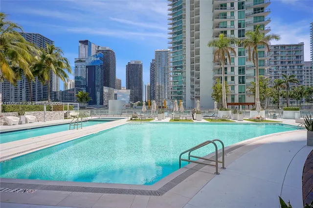 a view of swimming pool with a building in the background