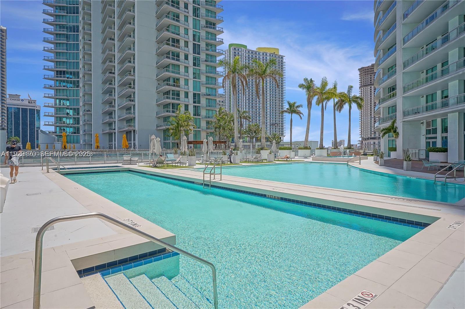 90 Southwest 3rd Street, Unit 1110 Miami, FL 33130 - Photo 33 of 55 a view of swimming pool with a building in the background