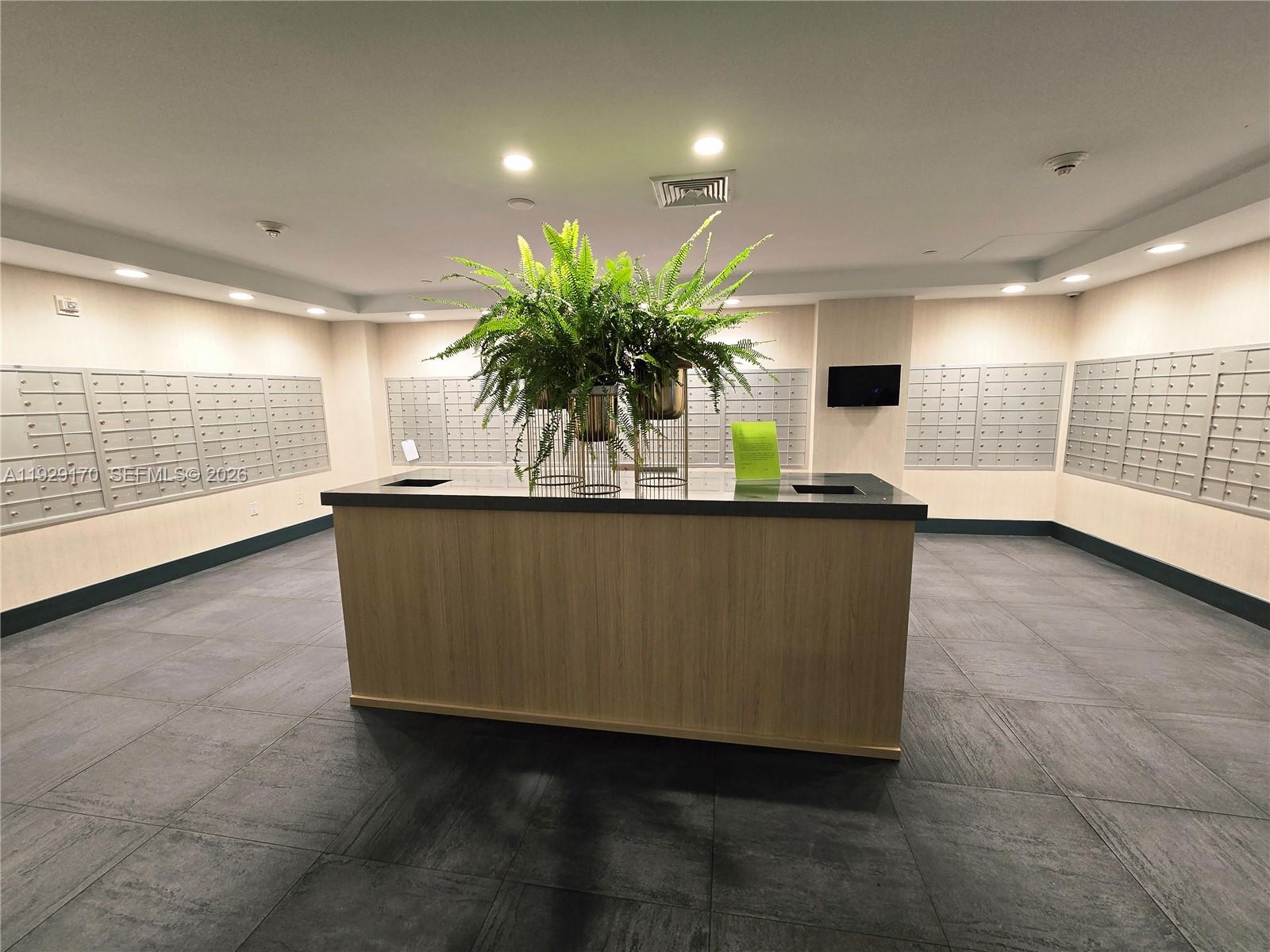 90 Southwest 3rd Street, Unit 1110 Miami, FL 33130 - Photo 42 of 55 a living room with furniture and a potted plant