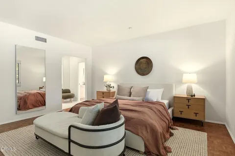a living room with furniture and a lamp