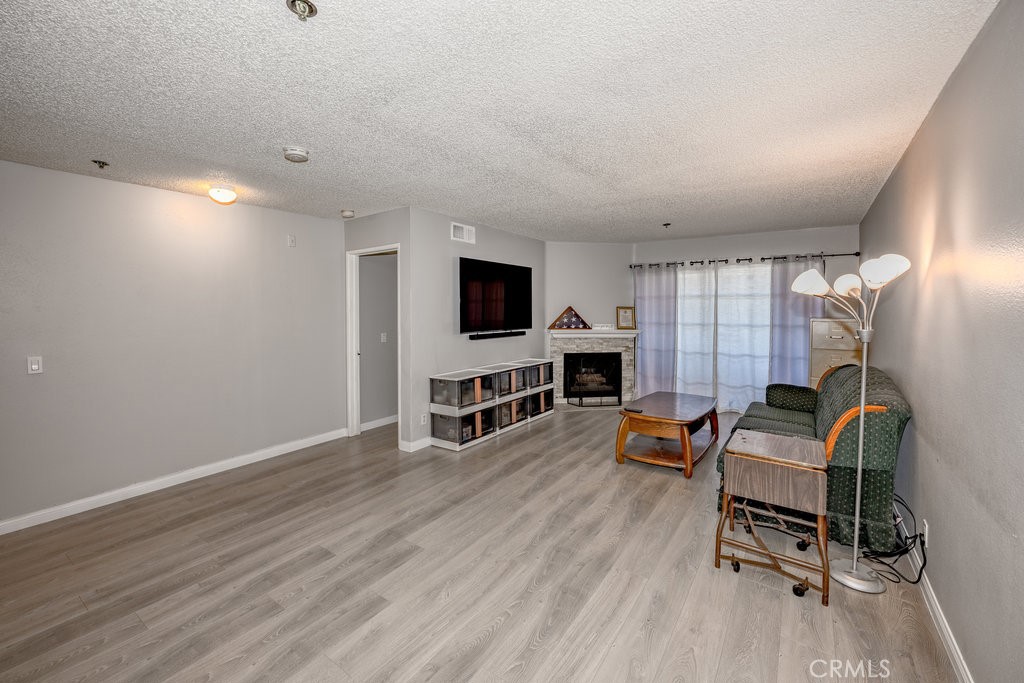 6545 Reseda Boulevard, Unit 3 Reseda, CA 91335 - Photo 2 of 12 a view of a livingroom with furniture and a flat screen tv
