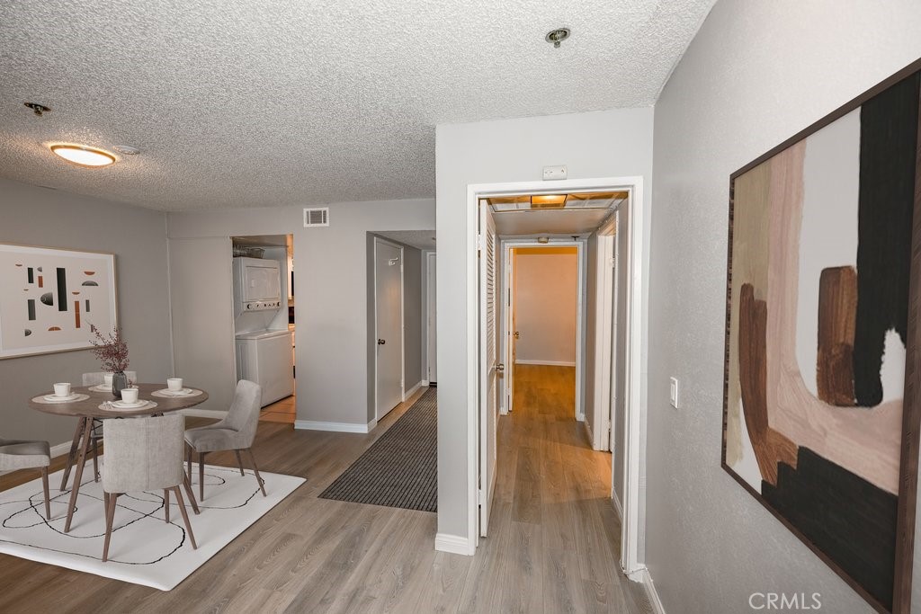 6545 Reseda Boulevard, Unit 3 Reseda, CA 91335 - Photo 2 of 11 a view of a hallway with wooden floor table and chairs