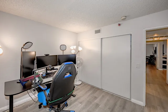 a workspace with furniture and wooden floor