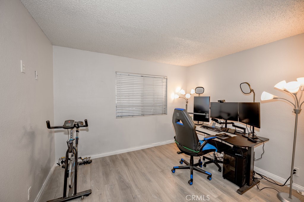 6545 Reseda Boulevard, Unit 3 Reseda, CA 91335 - Photo 8 of 12 a view of a workspace with furniture and a window