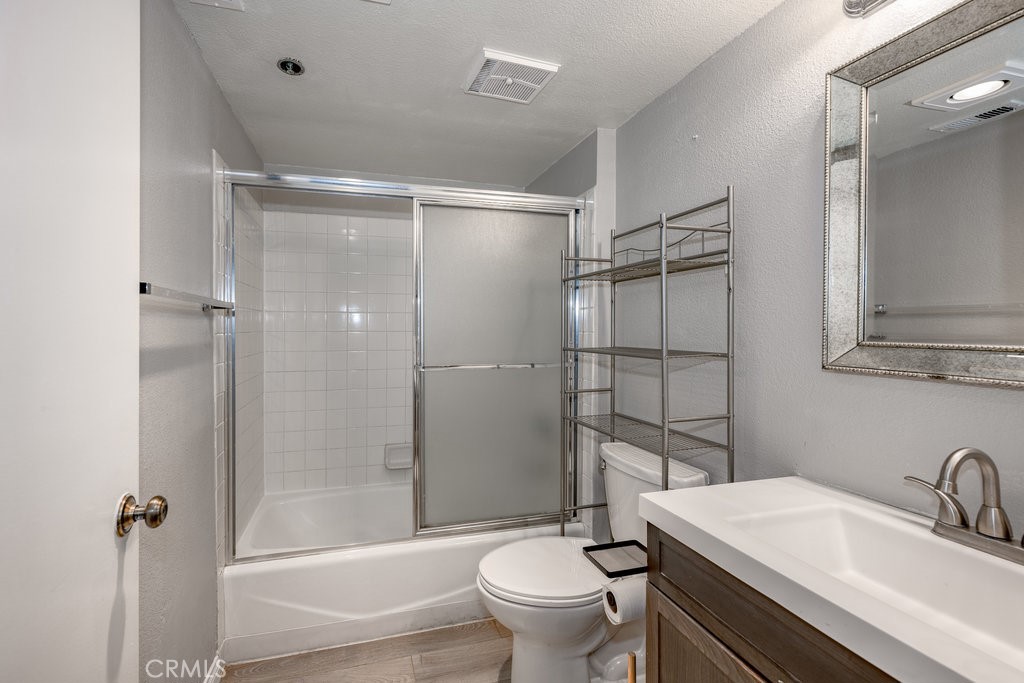 6545 Reseda Boulevard, Unit 3 Reseda, CA 91335 - Photo 9 of 11 a bathroom with a sink toilet and shower