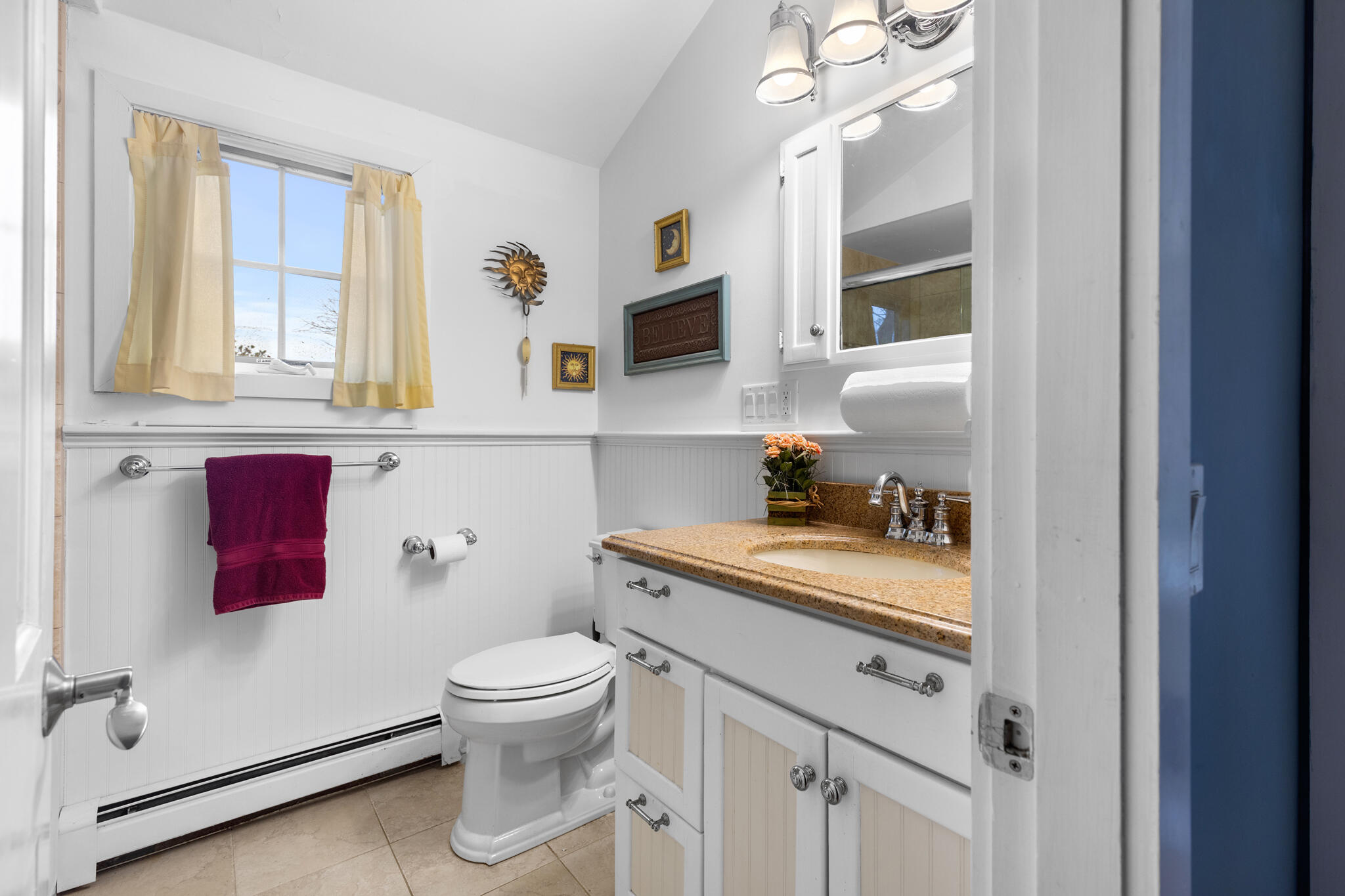 311 South Sunken Meadow Road Eastham, MA 02642 - Photo 26 of 57 a bathroom with a toilet a sink and a mirror