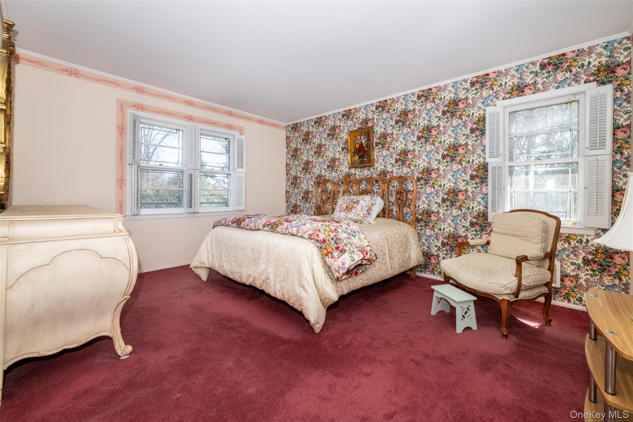 285 Stuart Drive New Rochelle, NY 10804 - Photo 13 of 37 a bedroom with a bed chair and a large window