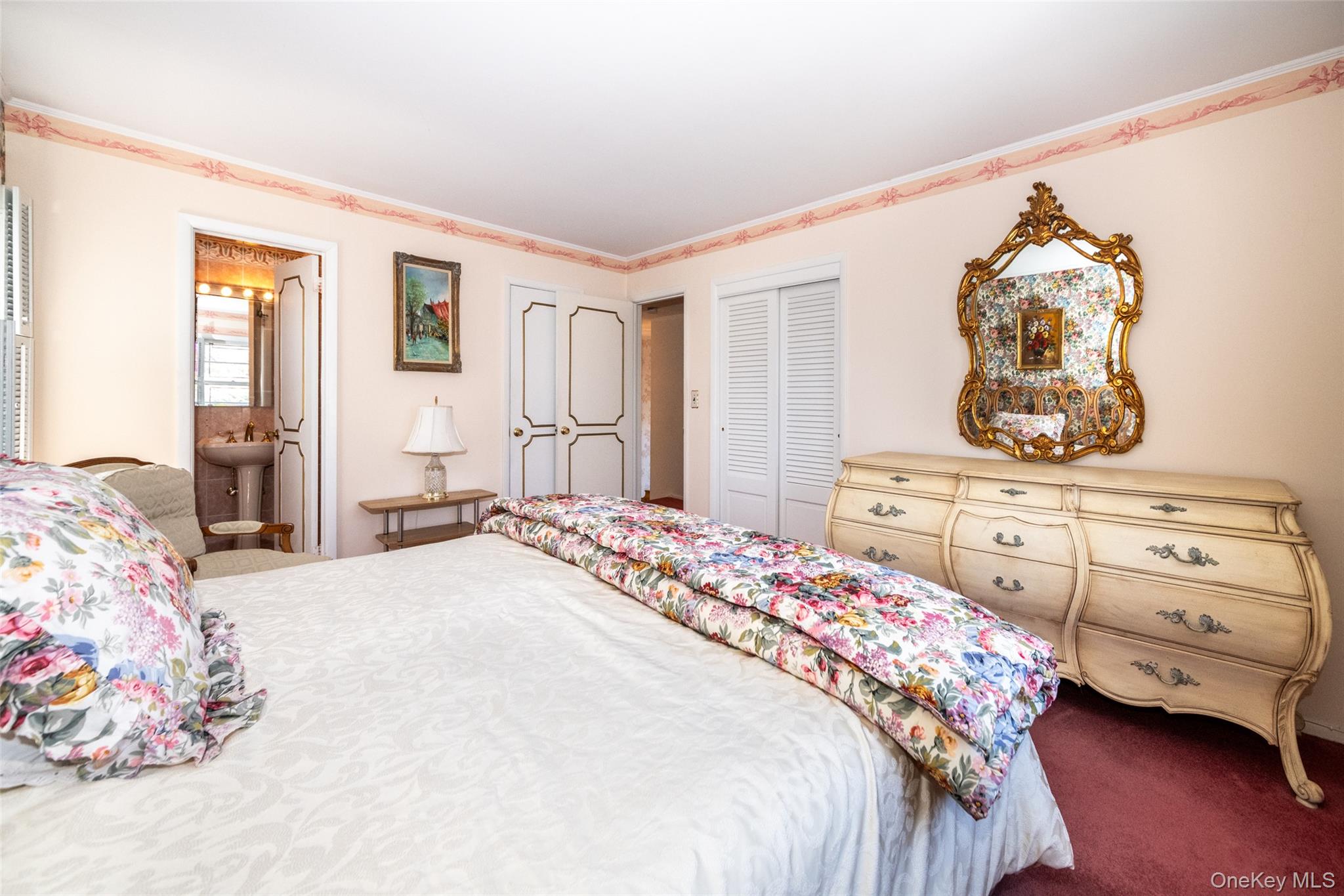 285 Stuart Drive New Rochelle, NY 10804 - Photo 14 of 37 a bedroom with a bed and dresser