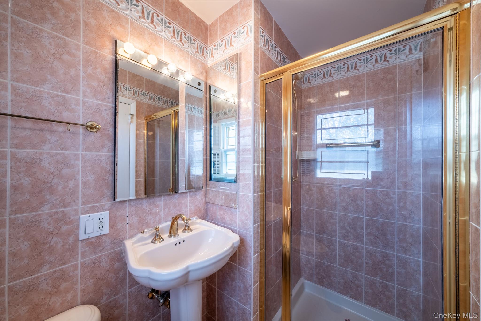 285 Stuart Drive New Rochelle, NY 10804 - Photo 15 of 37 a bathroom with a sink shower