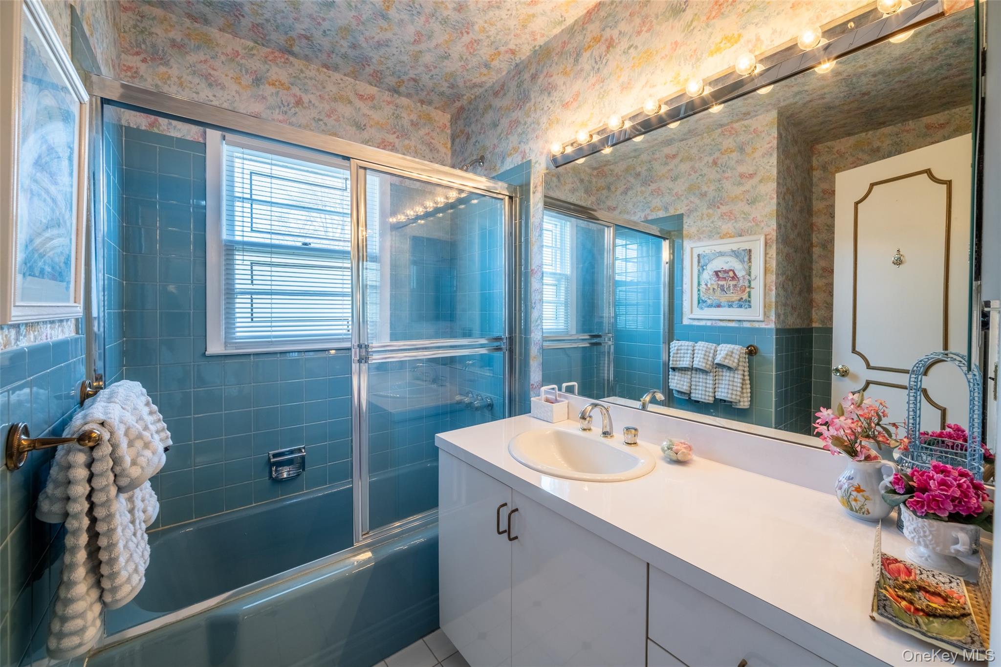 285 Stuart Drive New Rochelle, NY 10804 - Photo 18 of 37 a bathroom with a sink double vanity and a mirror