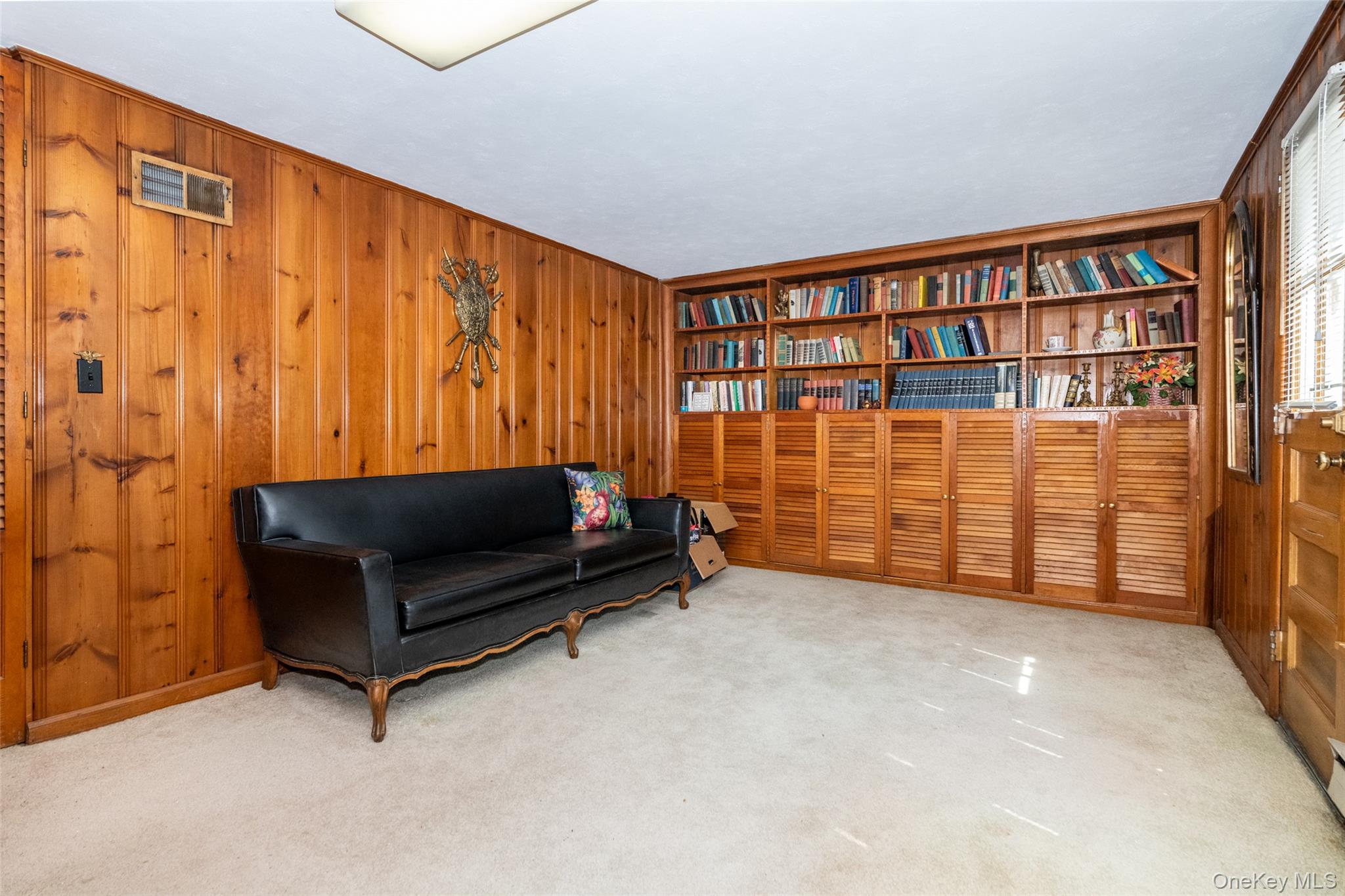 285 Stuart Drive New Rochelle, NY 10804 - Photo 25 of 37 a view of workspace with furniture and book shelf