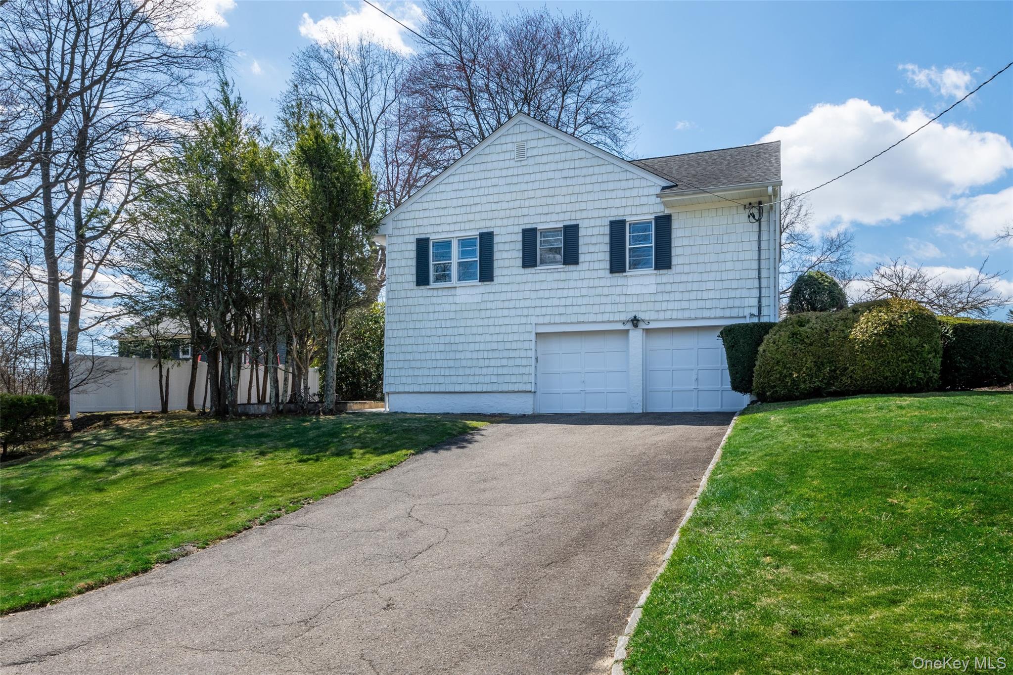 285 Stuart Drive New Rochelle, NY 10804 - Photo 33 of 37 a view of a yard in front of a house with a large tree