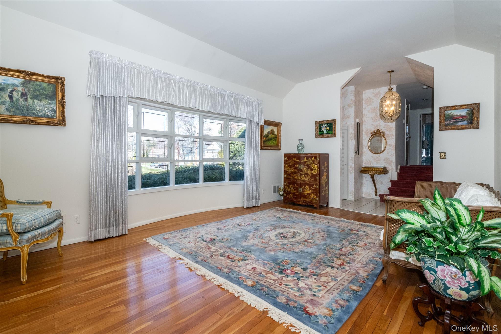 285 Stuart Drive New Rochelle, NY 10804 - Photo 4 of 37 a living room with furniture and a fireplace