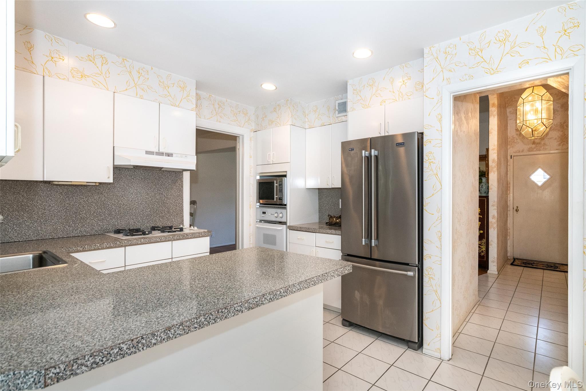 285 Stuart Drive New Rochelle, NY 10804 - Photo 10 of 37 a kitchen with granite countertop a refrigerator and a sink