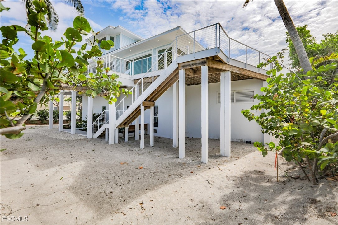 941 South Seas Plantation Road Captiva, FL 33924 - Photo 44 of 50 a view of a house with a yard and a tree