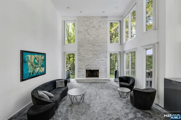 a living room with furniture a window and a fireplace